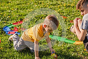 Family grass boy brother park. cheerful