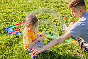 Family grass boy brother park. happy cheerful