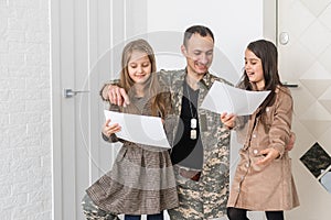 Family Greeting Military Father Home On Leave