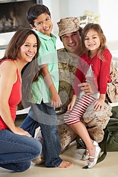 Family Greeting Military Father Home On Leave