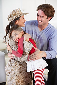 Family Greeting Military Mother Home On Leave