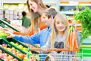 Family grocery shopping in hypermarket