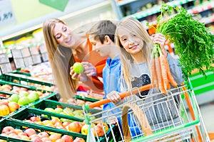 Family grocery shopping in hypermarket