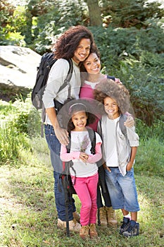 Family Group Hiking In Woods Together