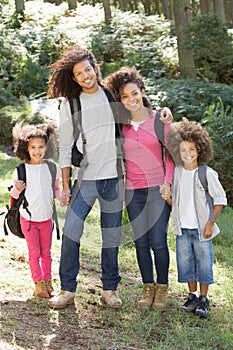 Family Group Hiking In Woods Together