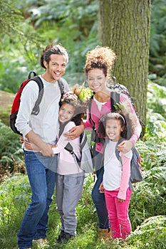 Family Group Hiking In Woods Together