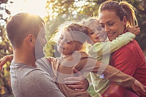 Family group hug. Young parents.