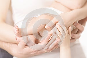 Family Hands and Baby New Born Foot, Mother Father Arms, Children Body Embrace Newborn Kid Feet