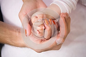 Family hands of father, mother and child together