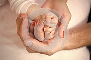 Family hands of father, mother and child together