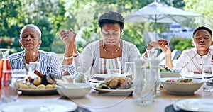 Family, hands and praying in outdoors for lunch, worship and spirituality for soul, support and belief. Black people