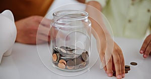 Family, hands and savings with coins in home, counting and lesson on money for child development. Father, son or bonding