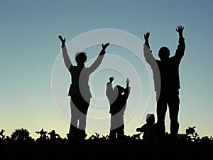 Family hands up silhouette
