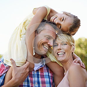 Family, happy and shoulder of parents and daughter, mother and portrait outdoors in park. Smile, love and bonding with