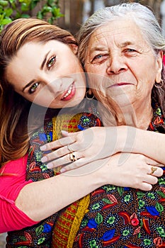 Family - happy young woman and grandmother