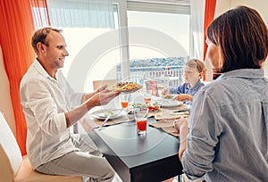 Family has a fresh cooking meal at dinner time