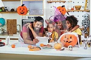 Family has fun in Halloween time make video call