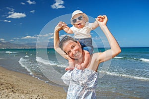 Family has fun at the seashore in summertime