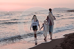Family have fun and live healthy lifestyle on beach. Selective focus