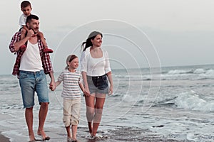 Family have fun and live healthy lifestyle on beach. Selective focus