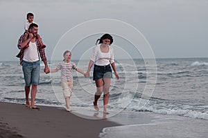 Family have fun and live healthy lifestyle on beach. Selective focus