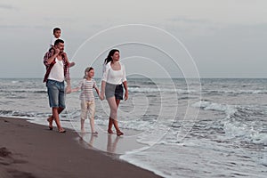 Family have fun and live healthy lifestyle on beach. Selective focus