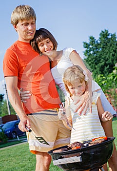 Family having barbecue outdoors