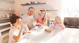 Family having breakfast in kitchen