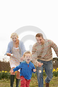 Family Having Egg And Spoon Race