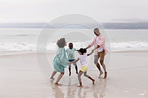 Family having fun on the beach