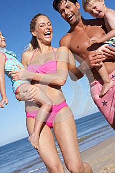 Family Having Fun On Beach