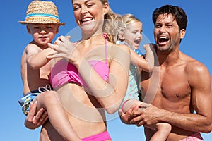 Family Having Fun On Beach