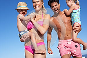 Family Having Fun On Beach