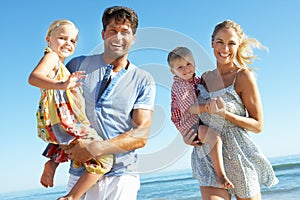 Family Having Fun On Beach