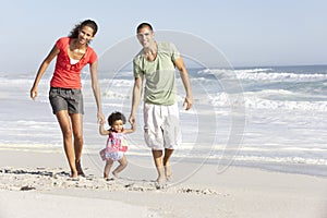 Family Having Fun On Beach