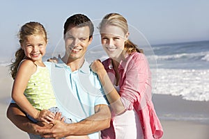 Family Having Fun On Beach