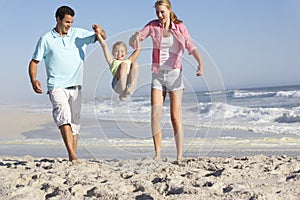 Family Having Fun On Beach