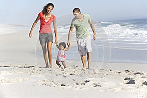 Family Having Fun On Beach