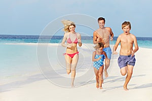 Family Having Fun On Beach Holiday