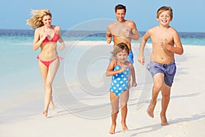 Family Having Fun On Beach Holiday