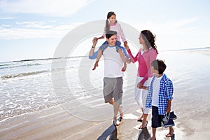 Family Having Fun On Beach Holiday