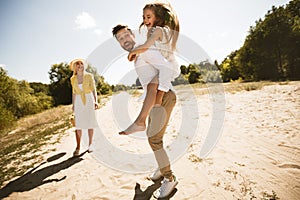 Family Having Fun Going On Picnic Walking Outdoor In Countryside