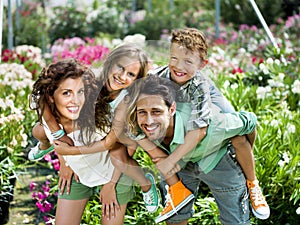 Family having fun in a greenhouse