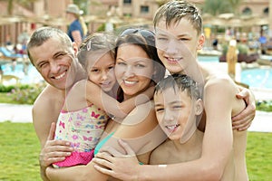 Family having fun near pool