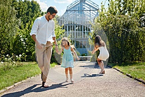 Family Having Fun Outdoor. Happy Young Parents, Children Playing