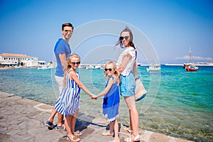 Family having fun outdoors on Mykonos streets