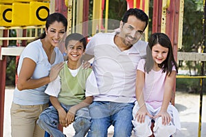 Family having fun in playground