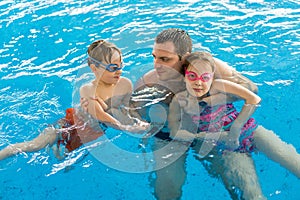 Family having fun in pool