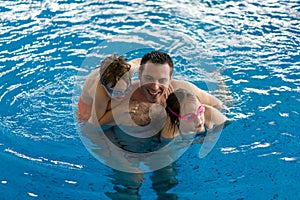 Family having fun in pool