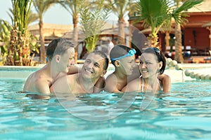 Family having fun in pool